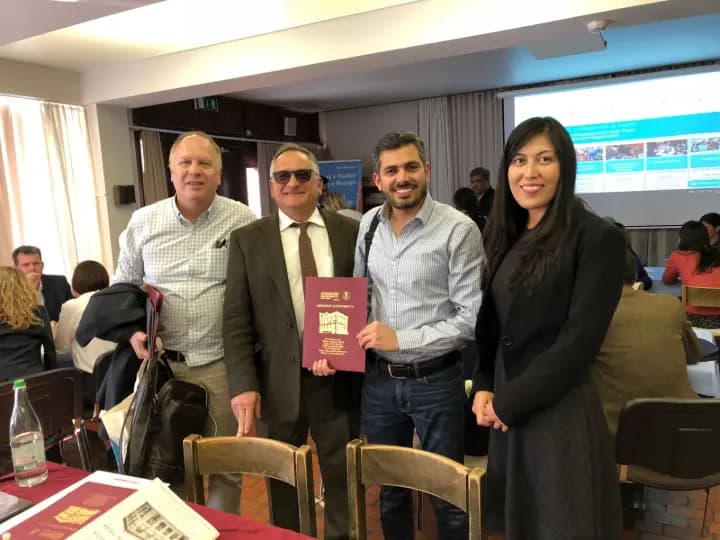 Study Bridge team with university representatives at an education conference